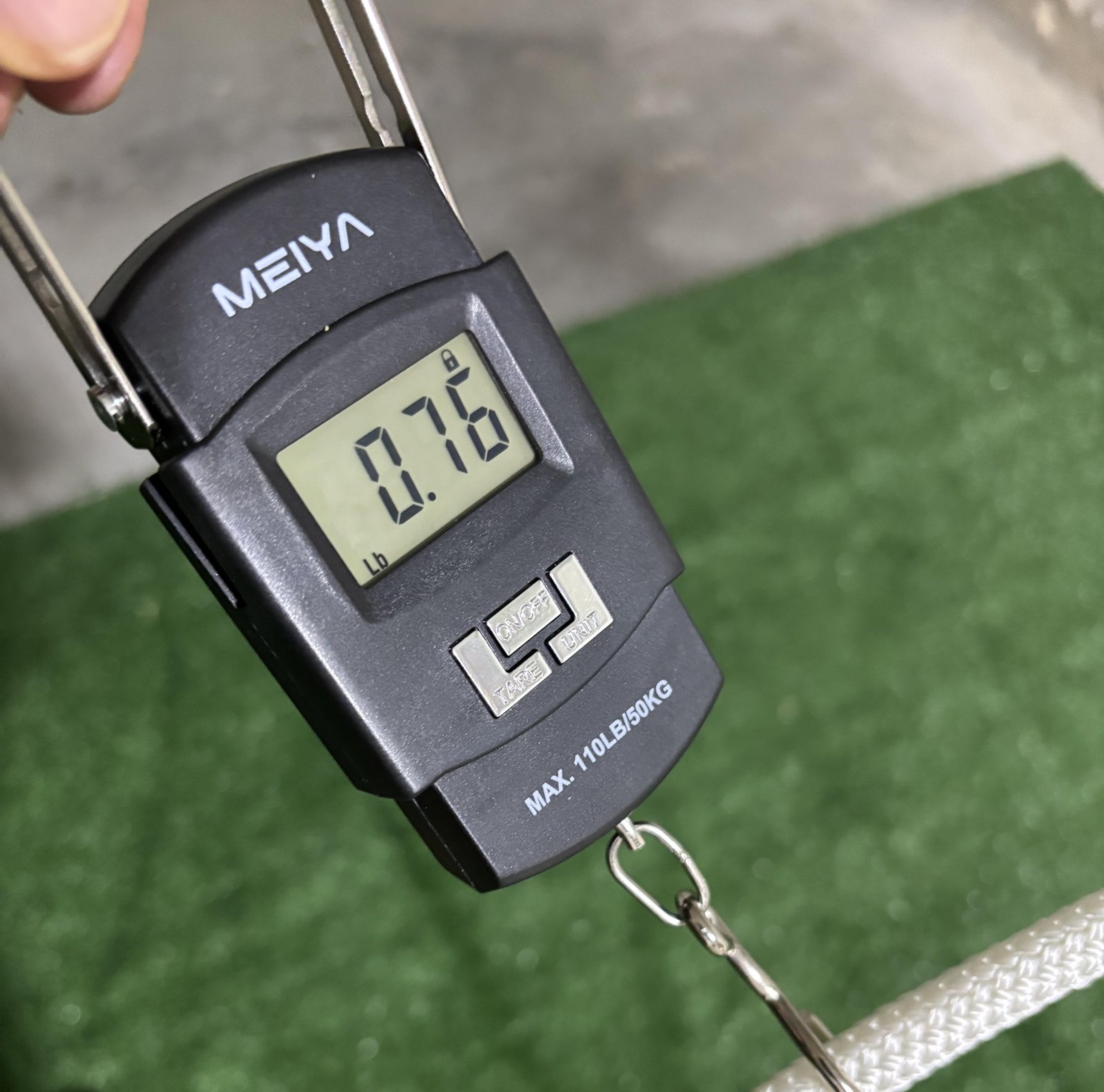 Technical graphic showing a tension gauge pulling a tie-down rope